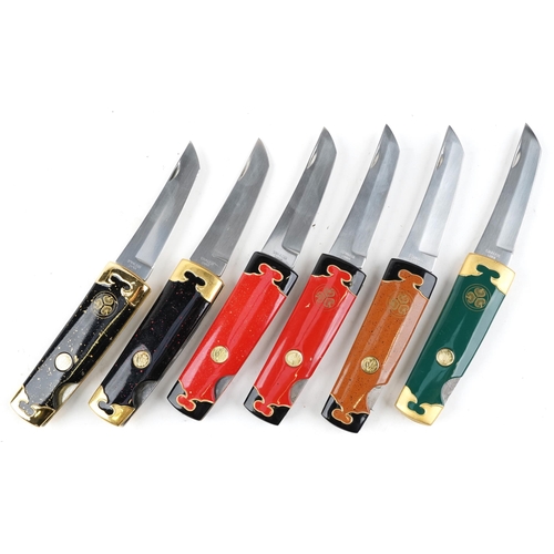 1249 - A group of six Franklin Mint Collector knives, various designs, within a display case, 34cm wide.