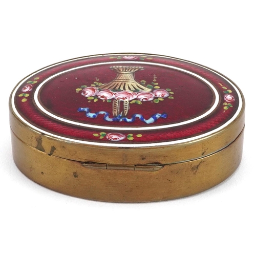 210 - An early 20th century oval brass and enamelled box with floral decoration, W-7cm.