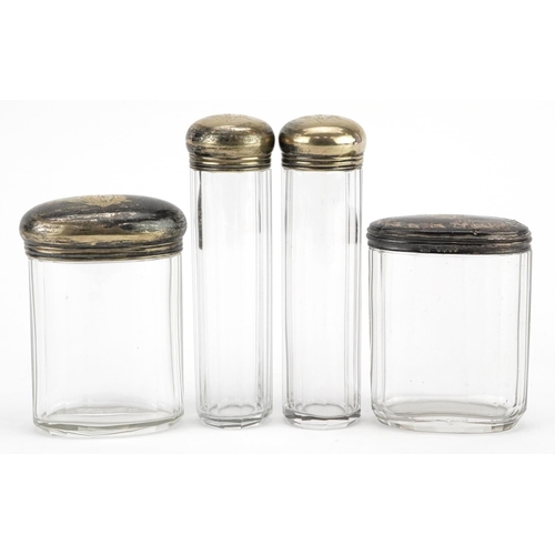 234 - Four silver topped glass dressing table jars, worn marks, H-12cm.