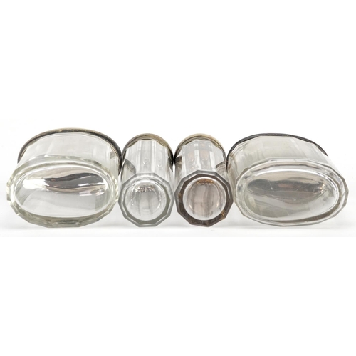 234 - Four silver topped glass dressing table jars, worn marks, H-12cm.