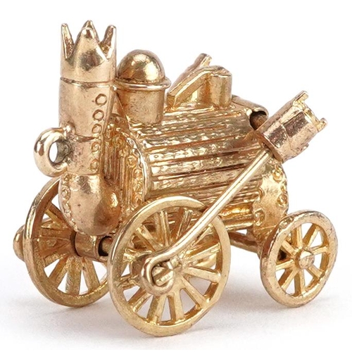 38 - A 9ct gold charm in the form of Stephenson's Rocket steam engine, 2.1cm in length, 7.0g.