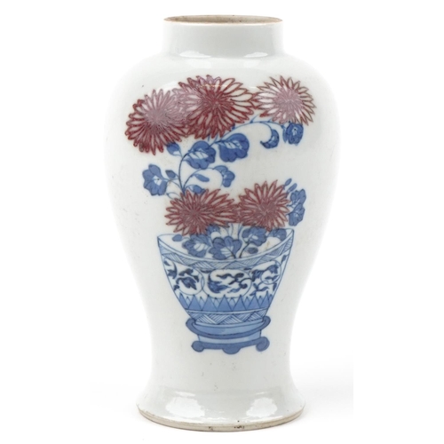 265 - A Chinese porcelain baluster vase hand painted with still life flowers in a vase and script, 16cm hi... 