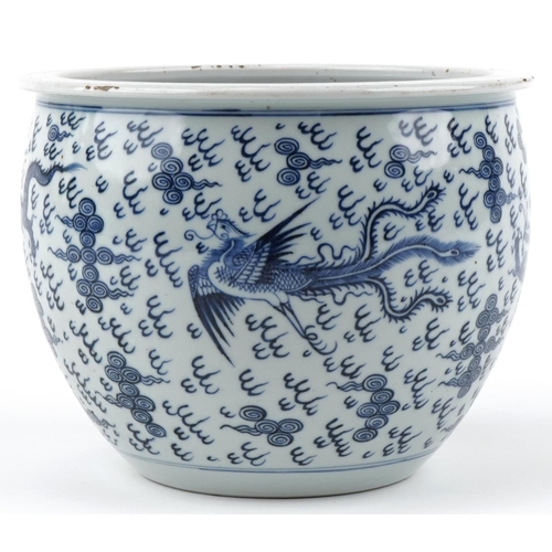 262 - A Chinese blue and white porcelain jardinière hand painted with dragons and phoenixes amongst clouds... 