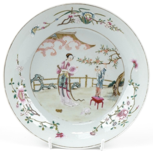 349 - A Chinese porcelain shallow dish hand painted with a Geisha and young figure in a courtyard amongst ... 