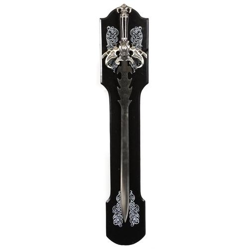 1284 - A decorative medieval style sword on a display stand, 123cm in length.