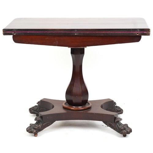 1046 - A Victorian mahogany fold-over card table, the carved frieze raised on a baluster column, platform b... 