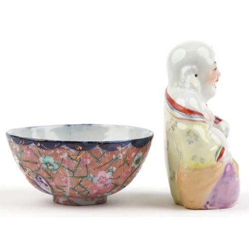 1248 - A Chinese porcelain figure of Buddha, 20th century, together with a small Japanese porcelain bowl an... 