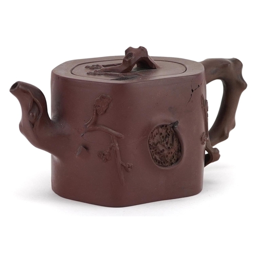 183 - A Chinese Yixing stoneware teapot, 20th century, with naturalistic decoration, 10cm high.