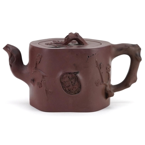 183 - A Chinese Yixing stoneware teapot, 20th century, with naturalistic decoration, 10cm high.