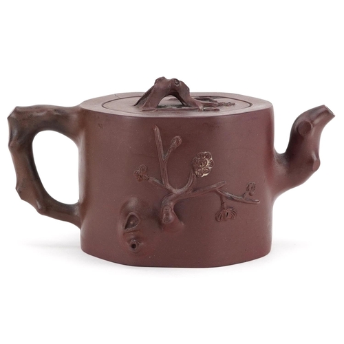 183 - A Chinese Yixing stoneware teapot, 20th century, with naturalistic decoration, 10cm high.