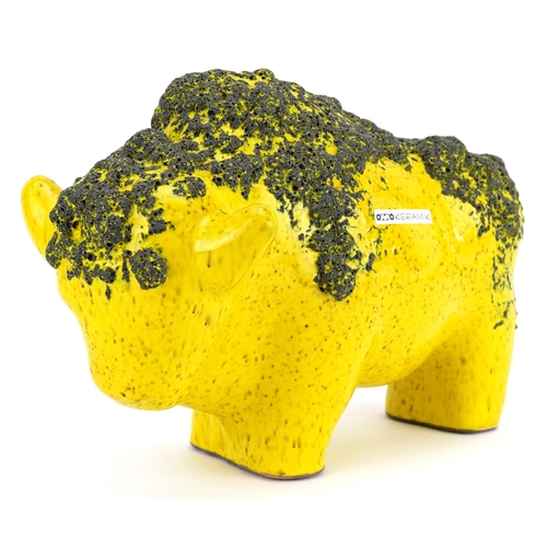 An Otto Keramik West German pottery bull, model number 1012, with yellow fat lava glaze, 32cm in length.