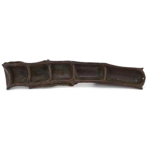 1315 - A Japanese patinated bronze study of two insects on bamboo, impressed marks, 16cm in length.