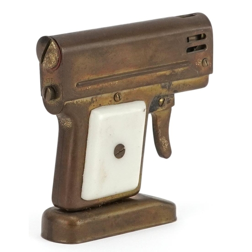 1171 - A novelty table lighter in the form of a pistol, 7cm high.