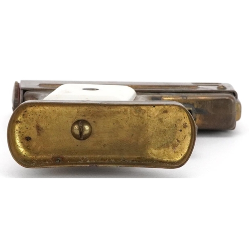 1171 - A novelty table lighter in the form of a pistol, 7cm high.