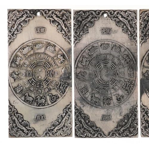 1324 - Five Chinese white metal scroll weights decorated with mythical animals, 9.8cm x 4.8cm, total 668.3g