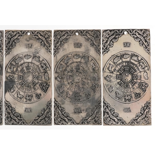 1324 - Five Chinese white metal scroll weights decorated with mythical animals, 9.8cm x 4.8cm, total 668.3g