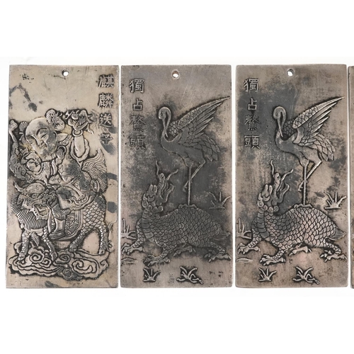 1324 - Five Chinese white metal scroll weights decorated with mythical animals, 9.8cm x 4.8cm, total 668.3g