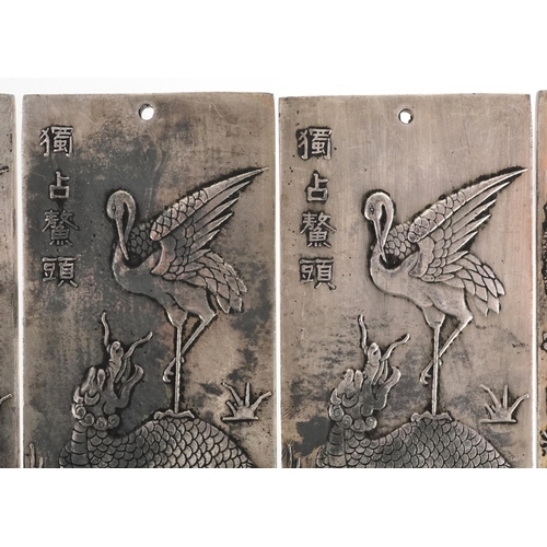 1324 - Five Chinese white metal scroll weights decorated with mythical animals, 9.8cm x 4.8cm, total 668.3g