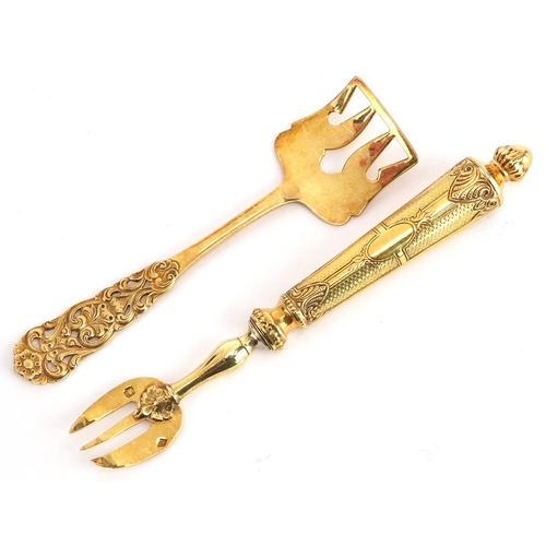 236 - A Norwegian silver gilt fork and food pusher, the largest 14cm in length, total 45.8g.