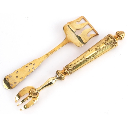 236 - A Norwegian silver gilt fork and food pusher, the largest 14cm in length, total 45.8g.