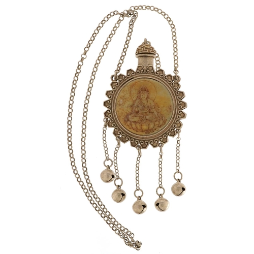 1275 - A Tibetan white metal scent bottle design necklace inset with a stone panel carved with Buddha, over... 