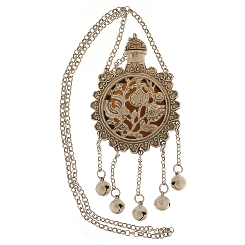 1275 - A Tibetan white metal scent bottle design necklace inset with a stone panel carved with Buddha, over... 