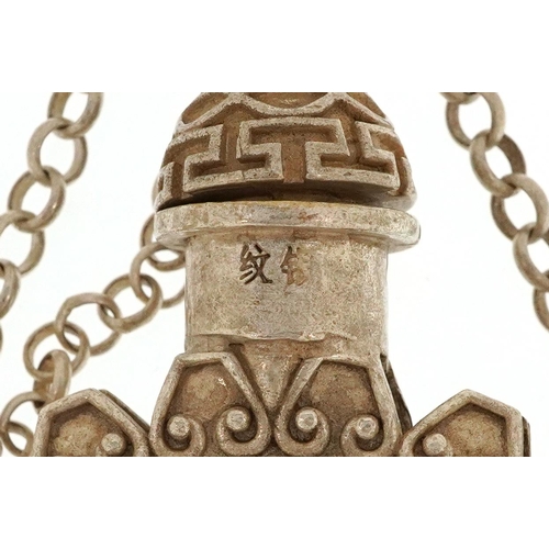 1275 - A Tibetan white metal scent bottle design necklace inset with a stone panel carved with Buddha, over... 