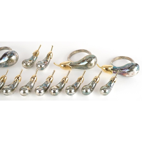 1357 - A set of Modernist silver plated napkin rings and napkin weights in the form of pears, the largest 7... 