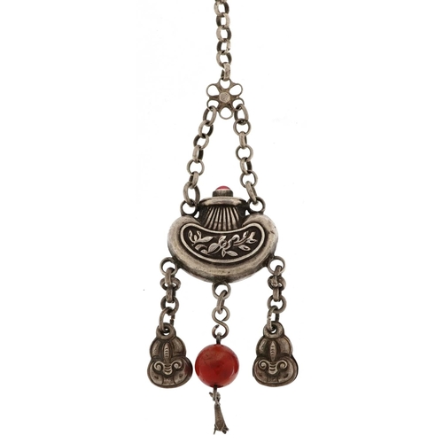 1263 - A Chinese white metal and carnelian tassel, 13cm in length, 26.5g.