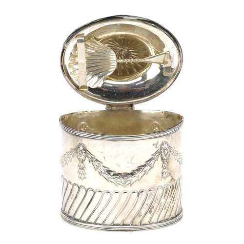 645 - Goldsmiths & Silversmiths Co Ltd., an Edwardian silver caddy with original caddy spoon to the inside... 