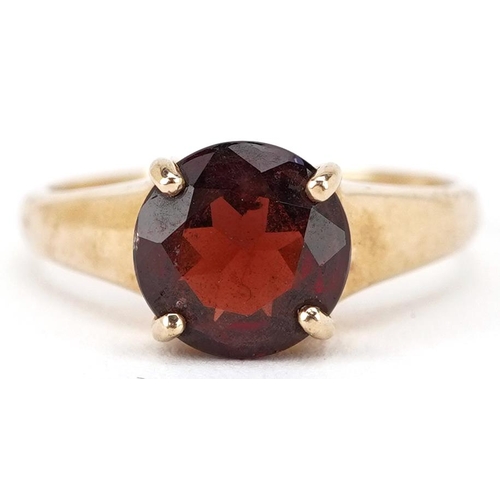 2209 - A 9ct gold garnet solitaire ring, size Q, 4.4g.