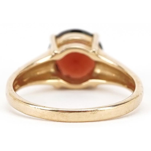 2209 - A 9ct gold garnet solitaire ring, size Q, 4.4g.