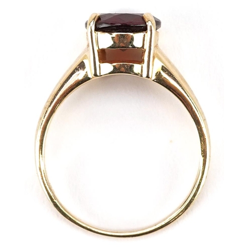 2209 - A 9ct gold garnet solitaire ring, size Q, 4.4g.