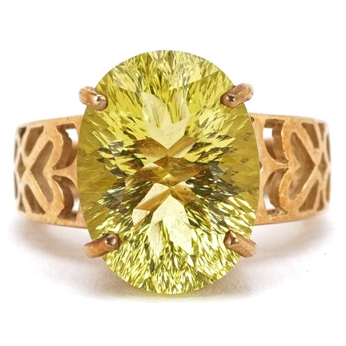 2395 - A large 9ct gold citrine solitaire ring with pierced shoulders, size N, 7.3g.