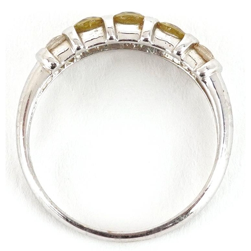 2167 - A 9ct white gold citrine and white spinel five stone ring, size N, 2.3g.