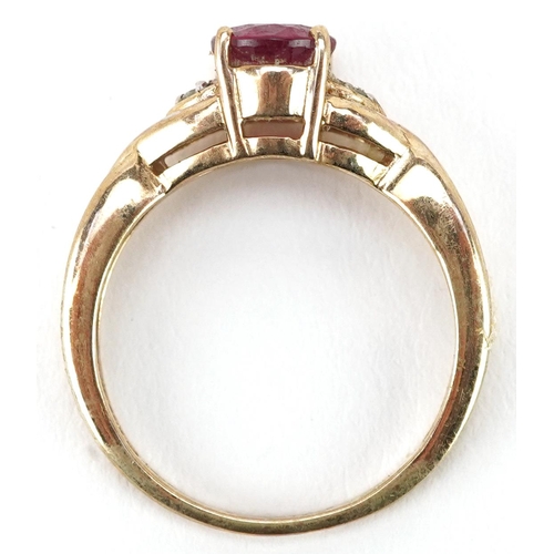 2198 - A 9ct gold pink stone solitaire ring with diamond set shoulders, size N, 2.8g.