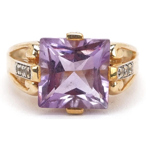 A 9ct gold square cut amethyst ring with diamond set shoulders, size N, 4.4g.