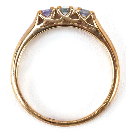 2212 - A 9ct gold blue and purple stone three stone ring, size N, 1.9g.