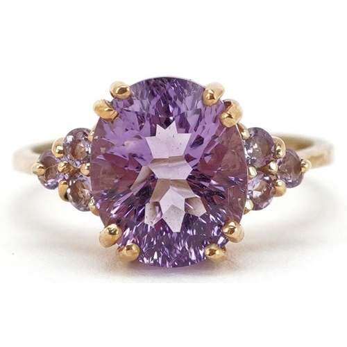 2202 - A 9ct gold amethyst and pink stone dress ring, size N, 3.4g.