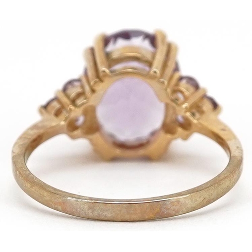 2202 - A 9ct gold amethyst and pink stone dress ring, size N, 3.4g.