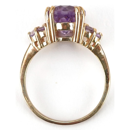 2202 - A 9ct gold amethyst and pink stone dress ring, size N, 3.4g.