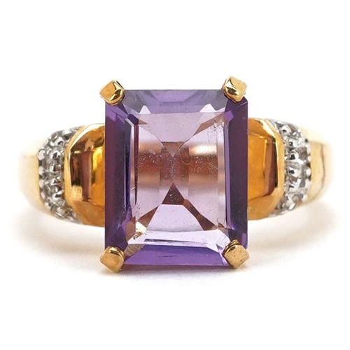 A 9ct gold rectangular cut amethyst ring with diamond set shoulders, size N, 4.8g.