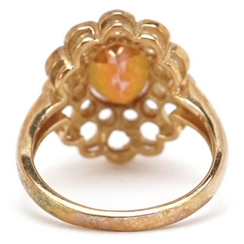 2165 - A 9ct gold rainbow quartz solitaire ring with ornate setting, size N, 4.9g.