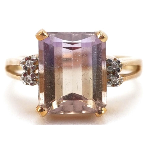 2340 - A 9ct gold rectangular cut rainbow quartz ring with diamond set shoulders, size N, 4.7g.