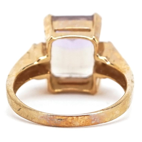 2340 - A 9ct gold rectangular cut rainbow quartz ring with diamond set shoulders, size N, 4.7g.