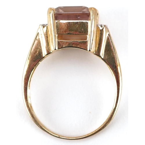 2340 - A 9ct gold rectangular cut rainbow quartz ring with diamond set shoulders, size N, 4.7g.