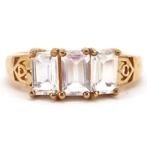 2343 - A 9ct gold opalescent three stone ring with pierced setting, size N, 2.7g.