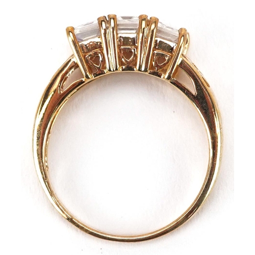 2343 - A 9ct gold opalescent three stone ring with pierced setting, size N, 2.7g.