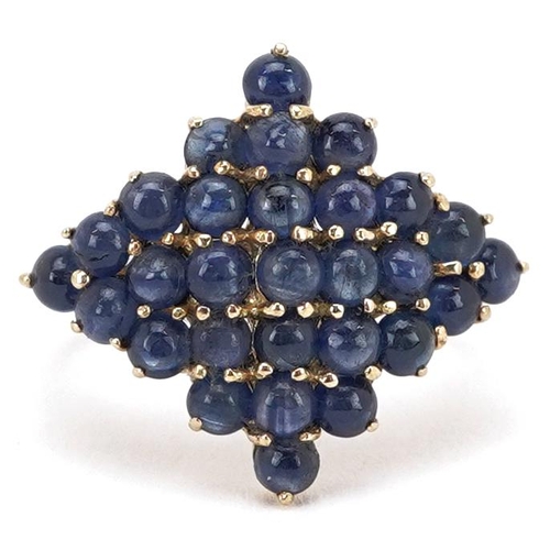 2066 - A 9ct gold cabochon sapphire cluster ring, size N, 3.9g.