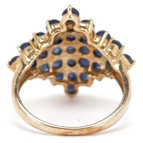 2066 - A 9ct gold cabochon sapphire cluster ring, size N, 3.9g.